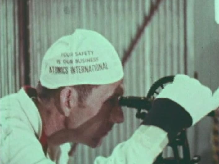 Man looking through a scope